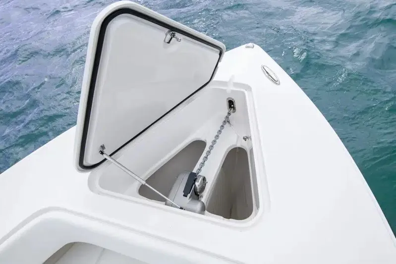  Yacht Photos Pics Open anchor compartment on 2019 Jupiter 34 HFS boat, with visible chain and ocean background.