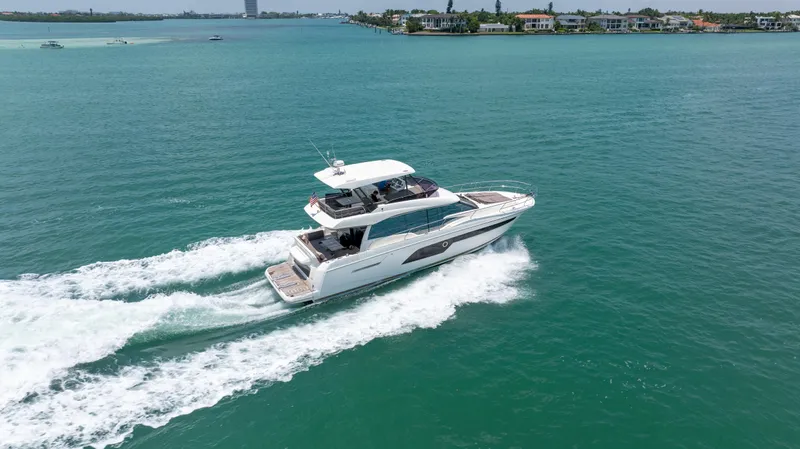 Motivated Seller Yacht Photos Pics 2019 Prestige 520 Flybridge yacht cruising on open water.