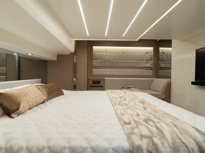 Motivated Seller Yacht Photos Pics Luxurious bedroom interior of 2019 Prestige 520 Flybridge yacht with modern lighting.