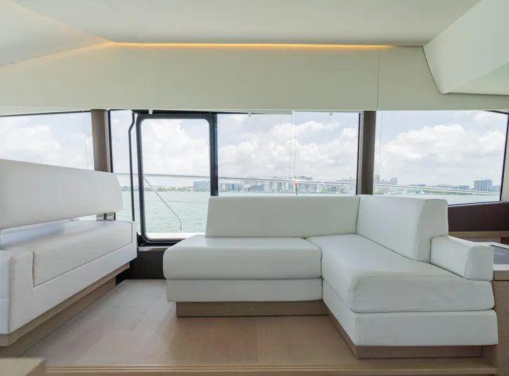 Motivated Seller Yacht Photos Pics Luxurious interior of 2019 Prestige 520 Flybridge yacht with white leather seating.