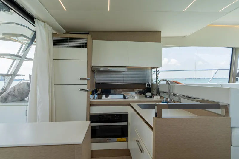 Motivated Seller Yacht Photos Pics Modern kitchen on a 2019 Prestige 520 Flybridge yacht with ocean view.