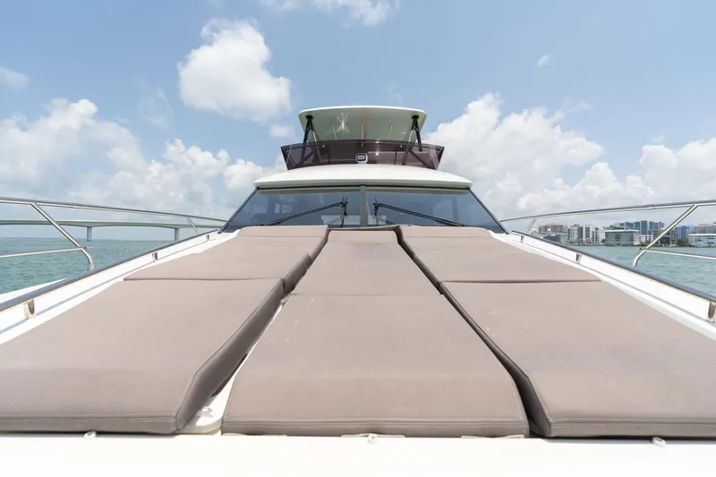 Motivated Seller Yacht Photos Pics 2019 Prestige 520 Flybridge yacht with sun loungers on deck.