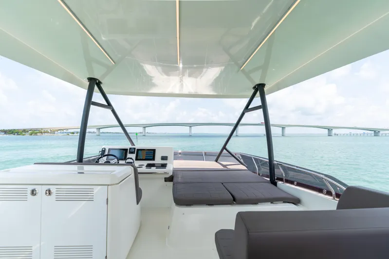 Motivated Seller Yacht Photos Pics Prestige 520 Flybridge 2019 yacht interior with ocean view and bridge in the background.