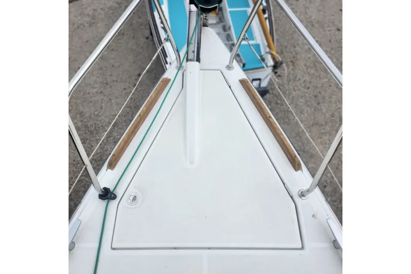  Yacht Photos Pics Bow view of 2023 Jeanneau Sun Odyssey 349 sailboat, featuring deck details and railing.
