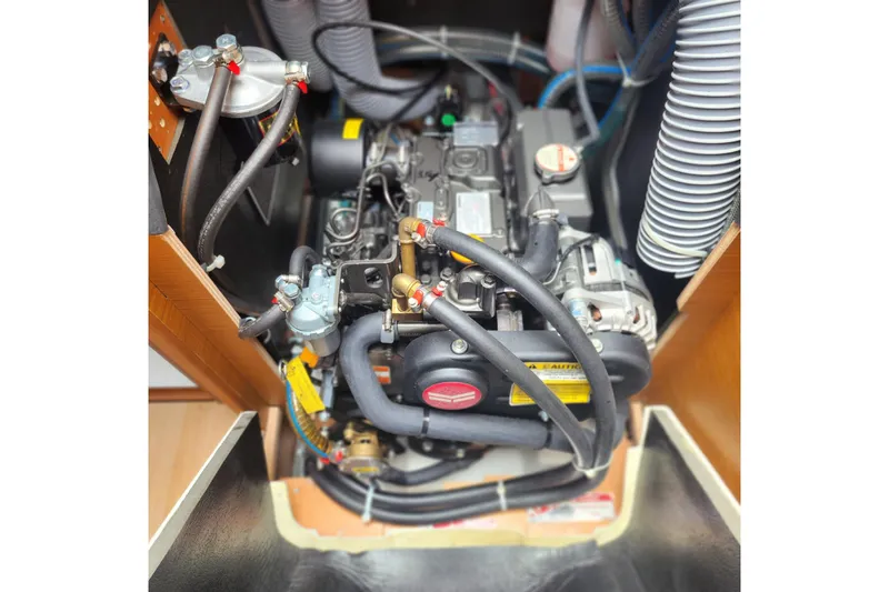  Yacht Photos Pics Engine compartment of 2023 Jeanneau Sun Odyssey 349 sailboat, showcasing detailed mechanical components.