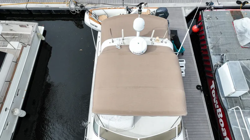 Next Chapter Yacht Photos Pics Aerial view of a 2004 Navigator Rival yacht docked at a marina.
