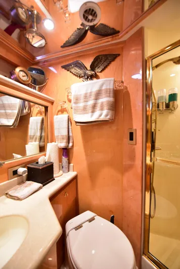 Next Chapter Yacht Photos Pics Luxurious 2004 Navigator Rival yacht bathroom with elegant decor and modern amenities.