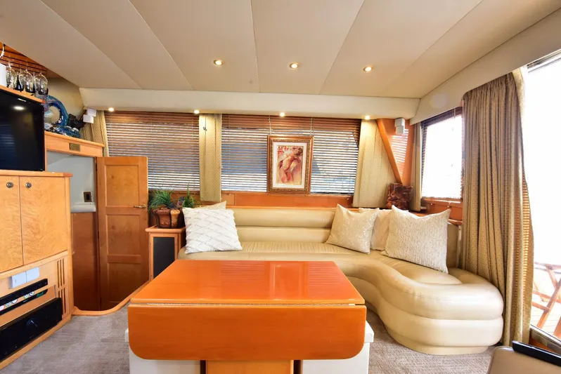 Next Chapter Yacht Photos Pics Luxurious 2004 Navigator Rival yacht interior with plush seating and elegant decor.