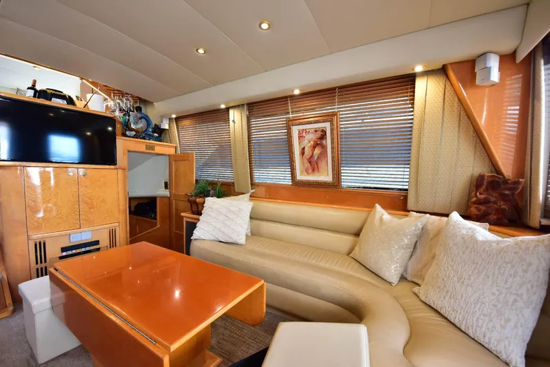 Next Chapter Yacht Photos Pics Luxurious 2004 Navigator Rival yacht interior with plush seating and elegant decor.
