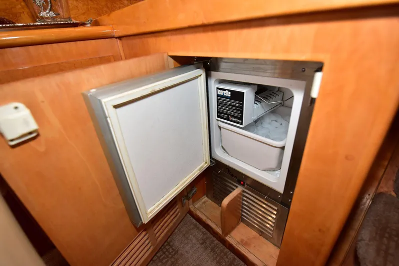 Next Chapter Yacht Photos Pics Open mini fridge in 2004 Navigator Rival boat interior.