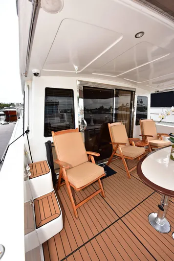 Next Chapter Yacht Photos Pics 2004 Navigator Rival yacht deck with seating and table.
