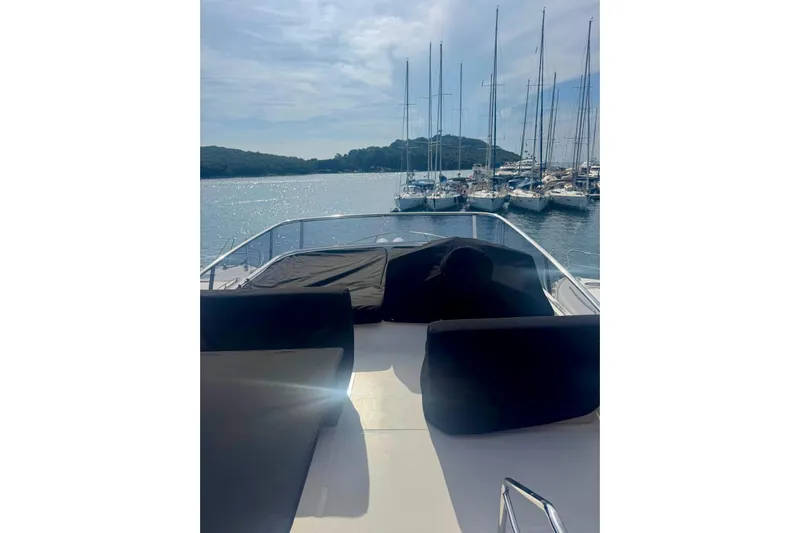  Yacht Photos Pics 2018 Cranchi E52 F yacht deck with marina view and sailboats.