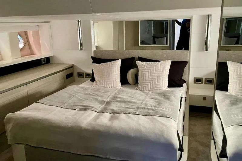  Yacht Photos Pics Luxurious bedroom interior of 2018 Cranchi E52 F yacht with modern decor.