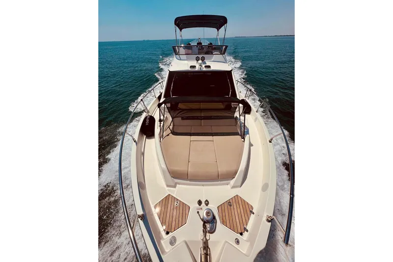  Yacht Photos Pics 2018 Cranchi E52 F yacht cruising on open water, showcasing sleek design and luxury features.