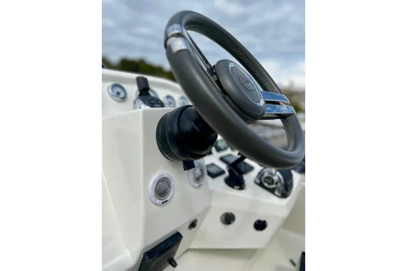  Yacht Photos Pics Steering wheel of 2018 Cranchi E52 F yacht, showcasing dashboard controls.