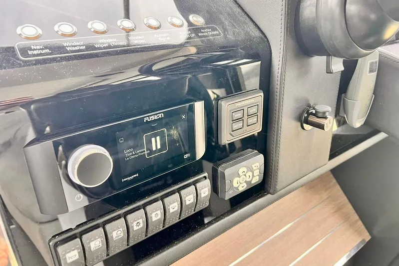  Yacht Photos Pics Control panel of a 2018 Cranchi E52 F yacht with audio system and switches.