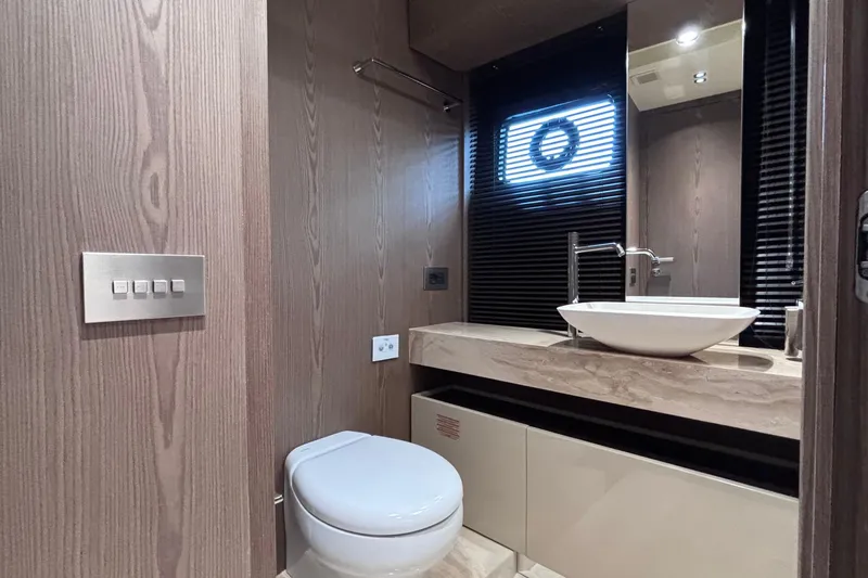  Yacht Photos Pics Luxurious bathroom interior of 2026 Invictus ST 550 yacht with modern fixtures.