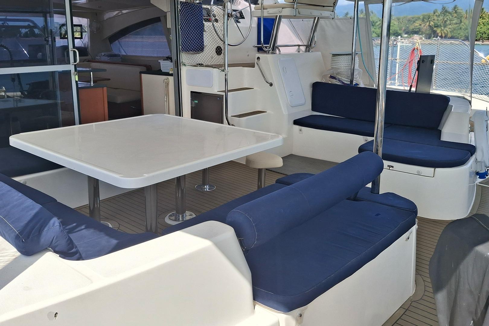 Luxurious 2013 Leopard 48 yacht interior with spacious seating and dining area.