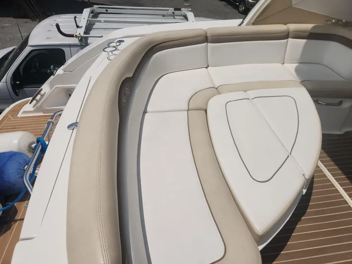  Yacht Photos Pics Luxurious seating on 2013 Sea Ray 370 Sundancer yacht, featuring beige and white upholstery.