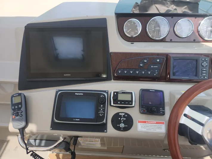  Yacht Photos Pics Control panel of a 2013 Sea Ray 370 Sundancer with navigation and communication equipment.