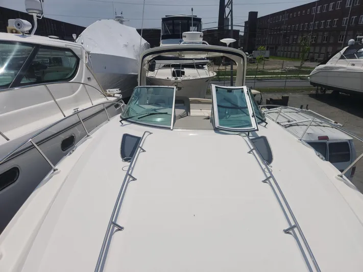  Yacht Photos Pics 2013 Sea Ray 370 Sundancer yacht docked, showcasing sleek design and open deck layout.