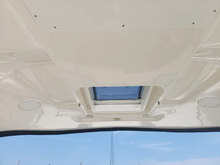  Yacht Photos Pics Ceiling view of 2013 Sea Ray 370 Sundancer with skylight and clear blue sky.