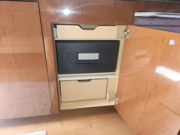  Yacht Photos Pics 2013 Sea Ray 370 Sundancer interior cabinet with open wooden drawers.