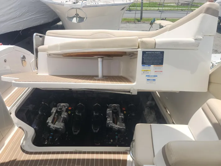  Yacht Photos Pics 2013 Sea Ray 370 Sundancer engine compartment with open hatch and seating area.