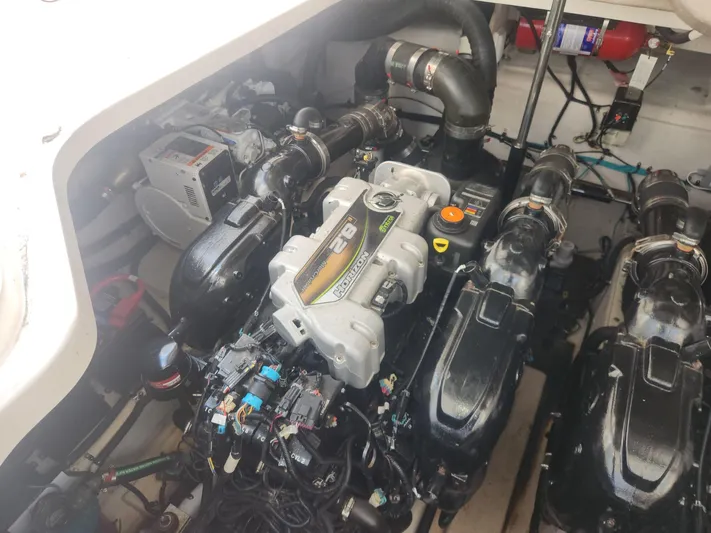  Yacht Photos Pics Engine compartment of a 2013 Sea Ray 370 Sundancer boat, showcasing dual engines and components.