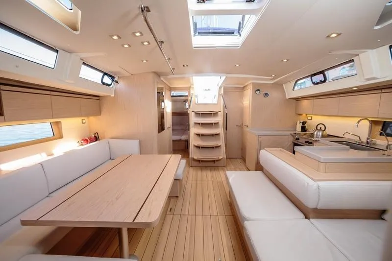  Yacht Photos Pics Luxurious interior of 2018 Beneteau Oceanis 51.1 yacht with modern furnishings and ample natural light.