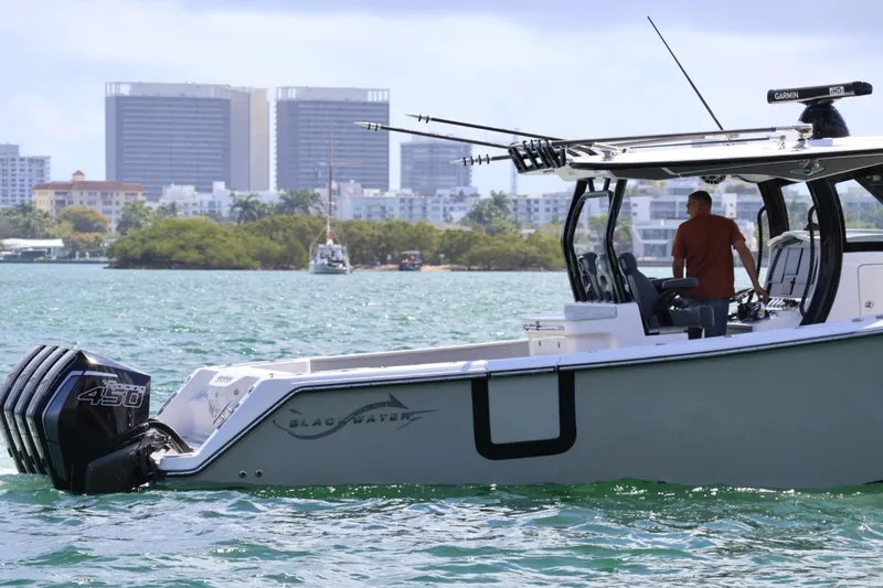  Yacht Photos Pics 2020 Blackwater 41 Performance Fish boat cruising near city skyline.