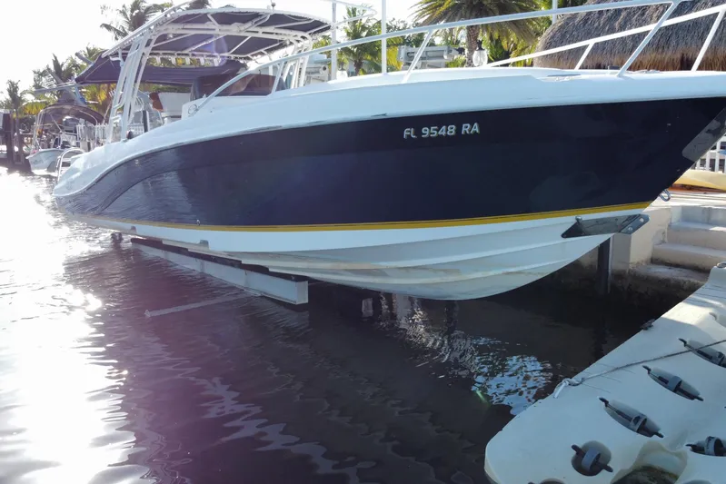  Yacht Photos Pics 2004 Deep Impact 36 DI boat docked in sunny marina setting.