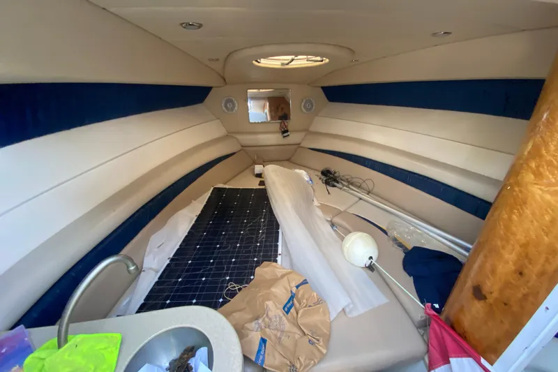  Yacht Photos Pics Interior cabin of 2004 Deep Impact 36 DI boat with seating and equipment.