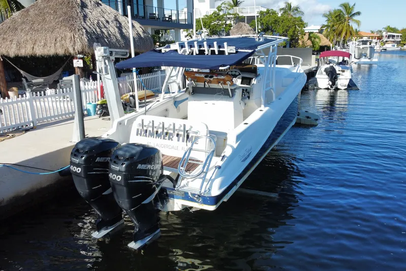  Yacht Photos Pics 2004 Deep Impact 36 DI boat docked with dual Mercury 400 engines.