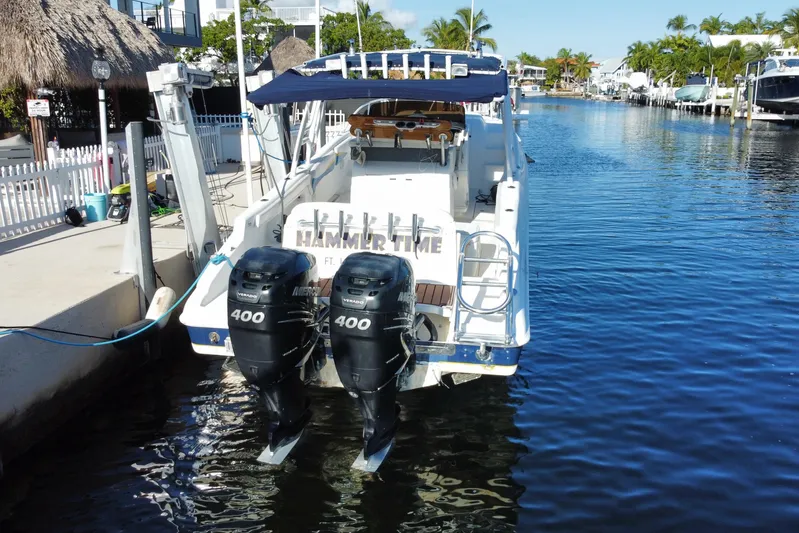  Yacht Photos Pics 2004 Deep Impact 36 DI boat docked with dual Mercury 400 engines.
