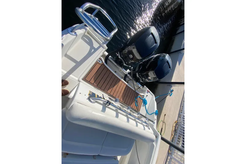  Yacht Photos Pics 2004 Deep Impact 36 DI boat with dual outboard motors docked at marina.