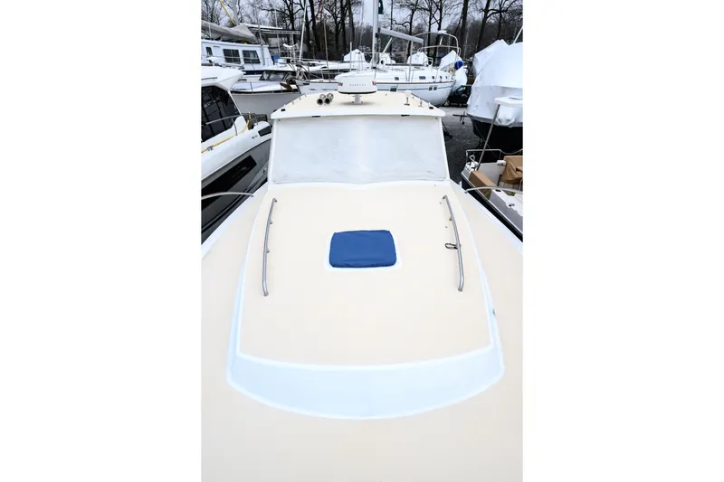 Staying Stoked Yacht Photos Pics 2005 MJM 34z Downeast boat deck view, surrounded by other docked boats.