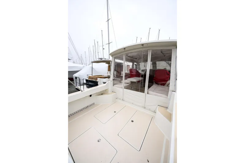 Staying Stoked Yacht Photos Pics 2005 MJM 34z Downeast boat with enclosed cockpit and red seating.