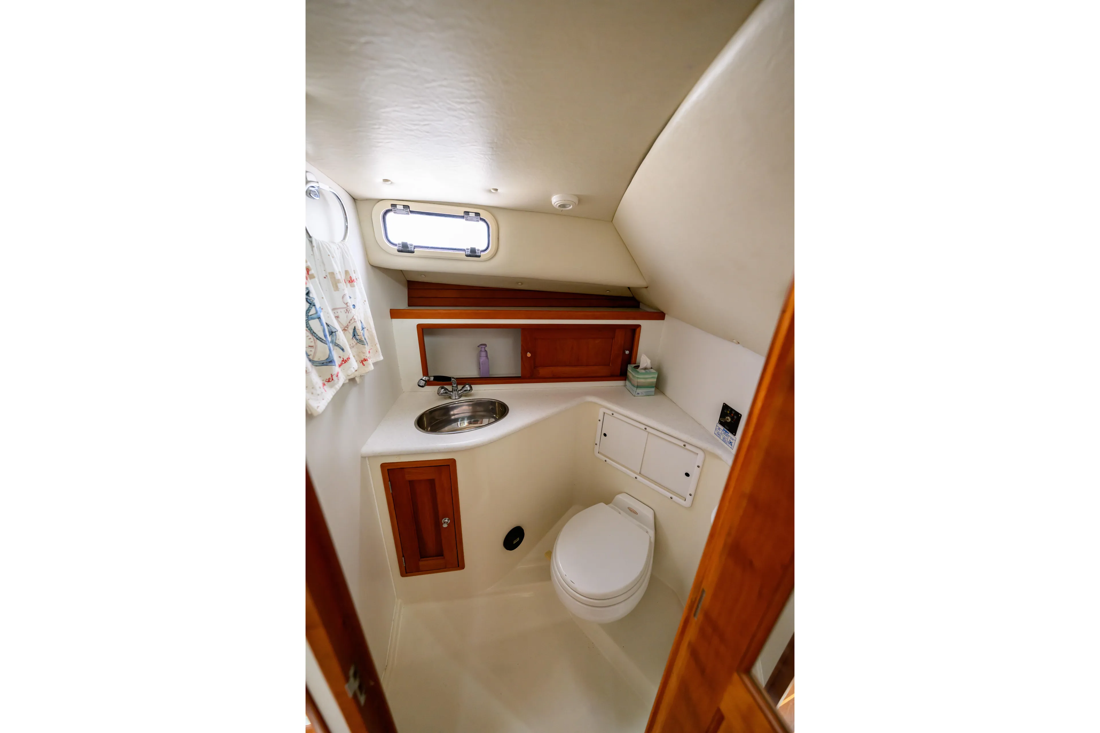 Staying Stoked Yacht Photos Pics Compact bathroom in 2005 MJM 34z Downeast boat with sink and toilet.