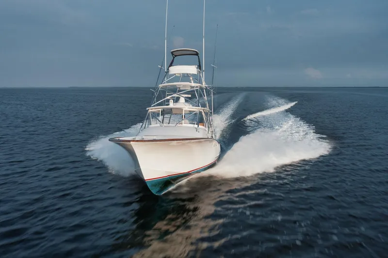 Dog House Yacht Photos Pics 2016 F&S Express boat speeding on open water, creating a dynamic wake.