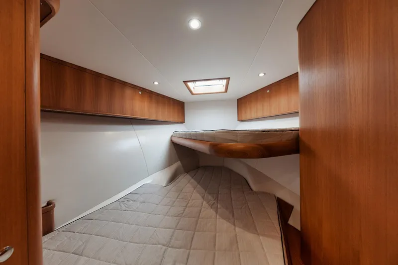 Dog House Yacht Photos Pics 2016 F&S Express yacht cabin with wooden interior and overhead lighting.