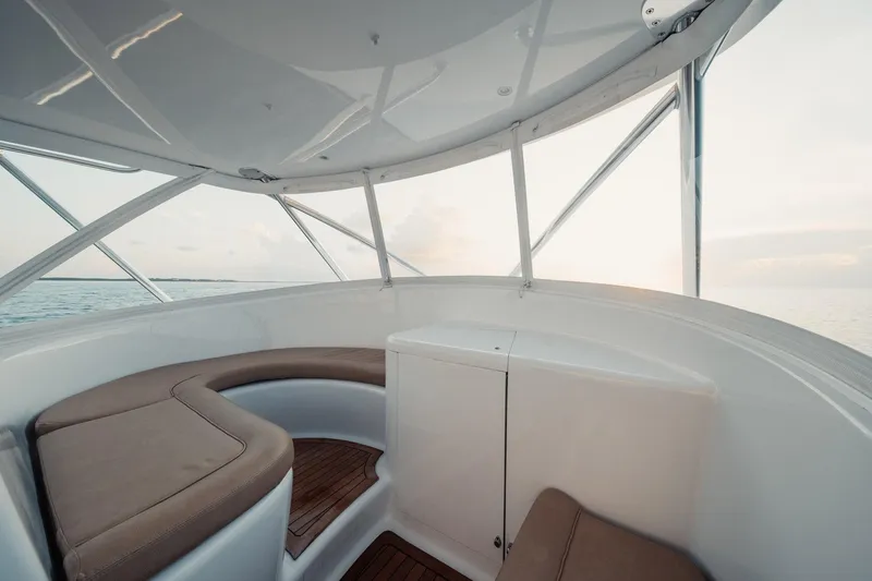 Dog House Yacht Photos Pics Interior of 2016 F&S Express boat with cushioned seating and ocean view.