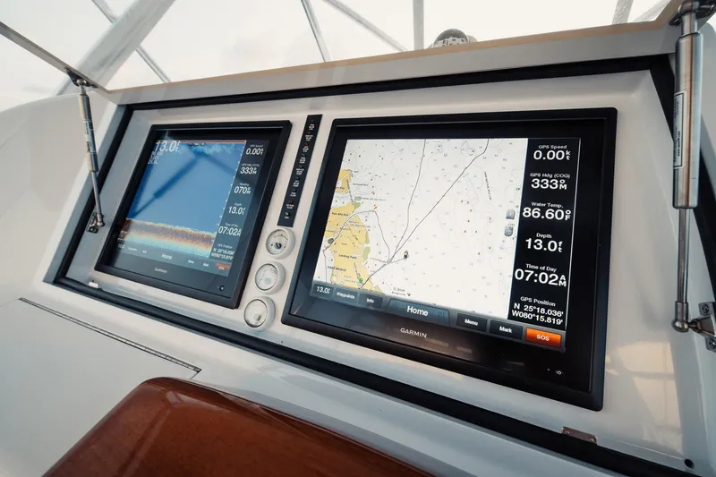 Dog House Yacht Photos Pics Dual Garmin navigation screens on 2016 F&S Express boat dashboard.