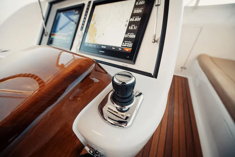 Dog House Yacht Photos Pics Control panel of 2016 F&S Express boat with navigation screens and joystick.