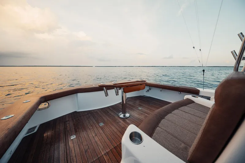 Dog House Yacht Photos Pics 2016 F&S Express boat deck with ocean view at sunset.