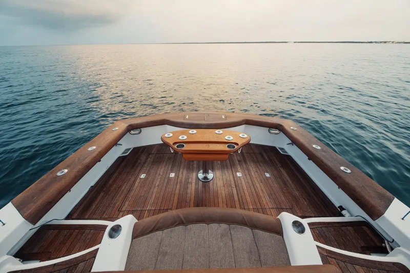 Dog House Yacht Photos Pics 2016 F&S Express boat deck overlooking calm ocean waters.