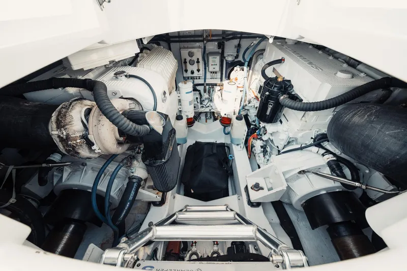 Dog House Yacht Photos Pics Engine room of a 2016 F&S Express boat, showcasing mechanical components and systems.