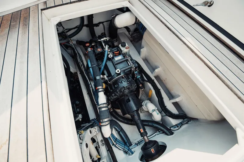 Dog House Yacht Photos Pics Engine compartment of a 2016 F&S Express boat, showcasing mechanical components and wiring.
