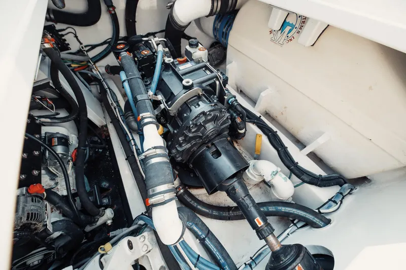 Dog House Yacht Photos Pics Engine compartment of a 2016 F&S Express boat, showcasing mechanical components and wiring.