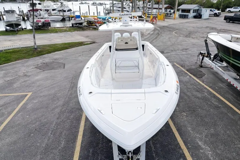  Yacht Photos Pics 2022 Intrepid 345 Nomad FE boat docked at marina, aerial view.